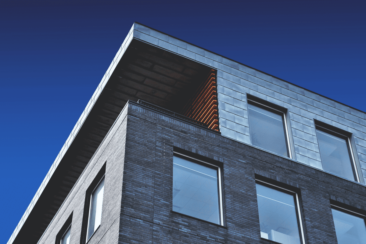 a building with windows and a blue sky