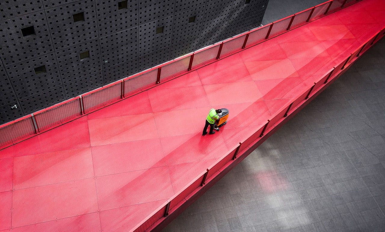 a person standing on a red bridge