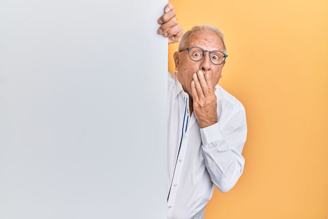 a person holding a white board