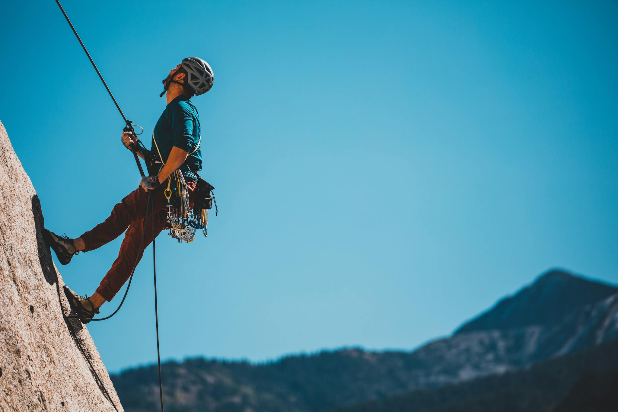 a person climbing a rock