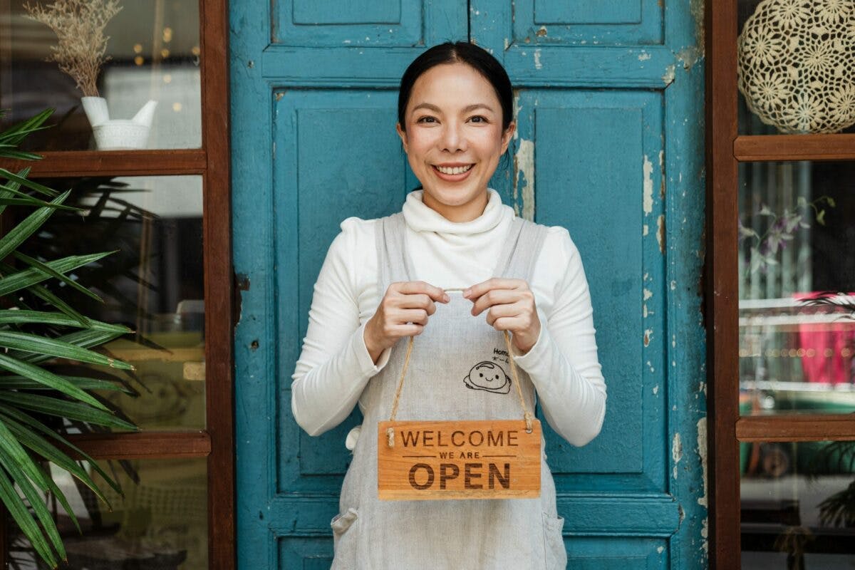 a woman holding a sign