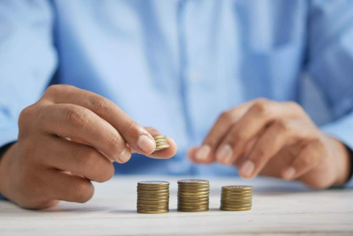 a person stacking coins