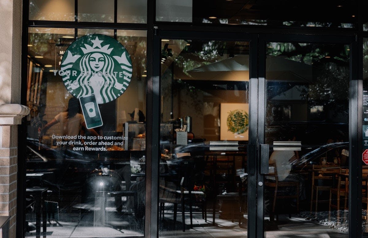 a glass door with a sign on it