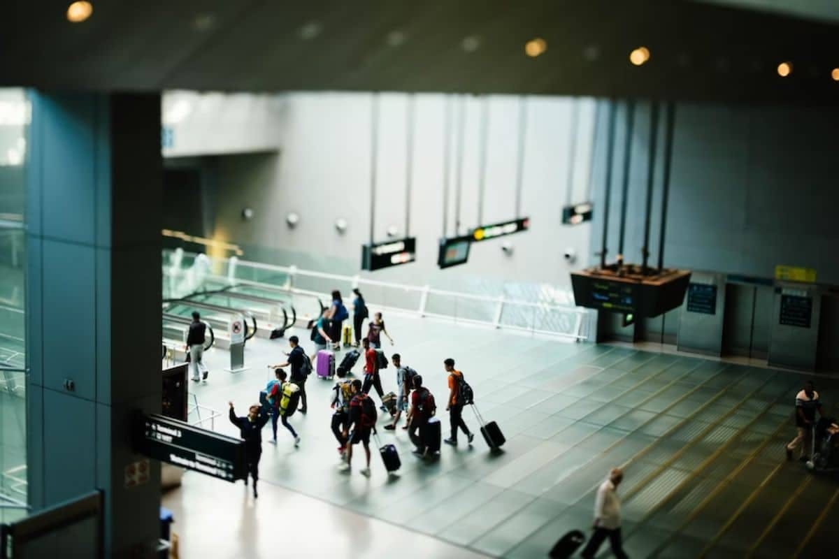 canadian travelles are walking in airport