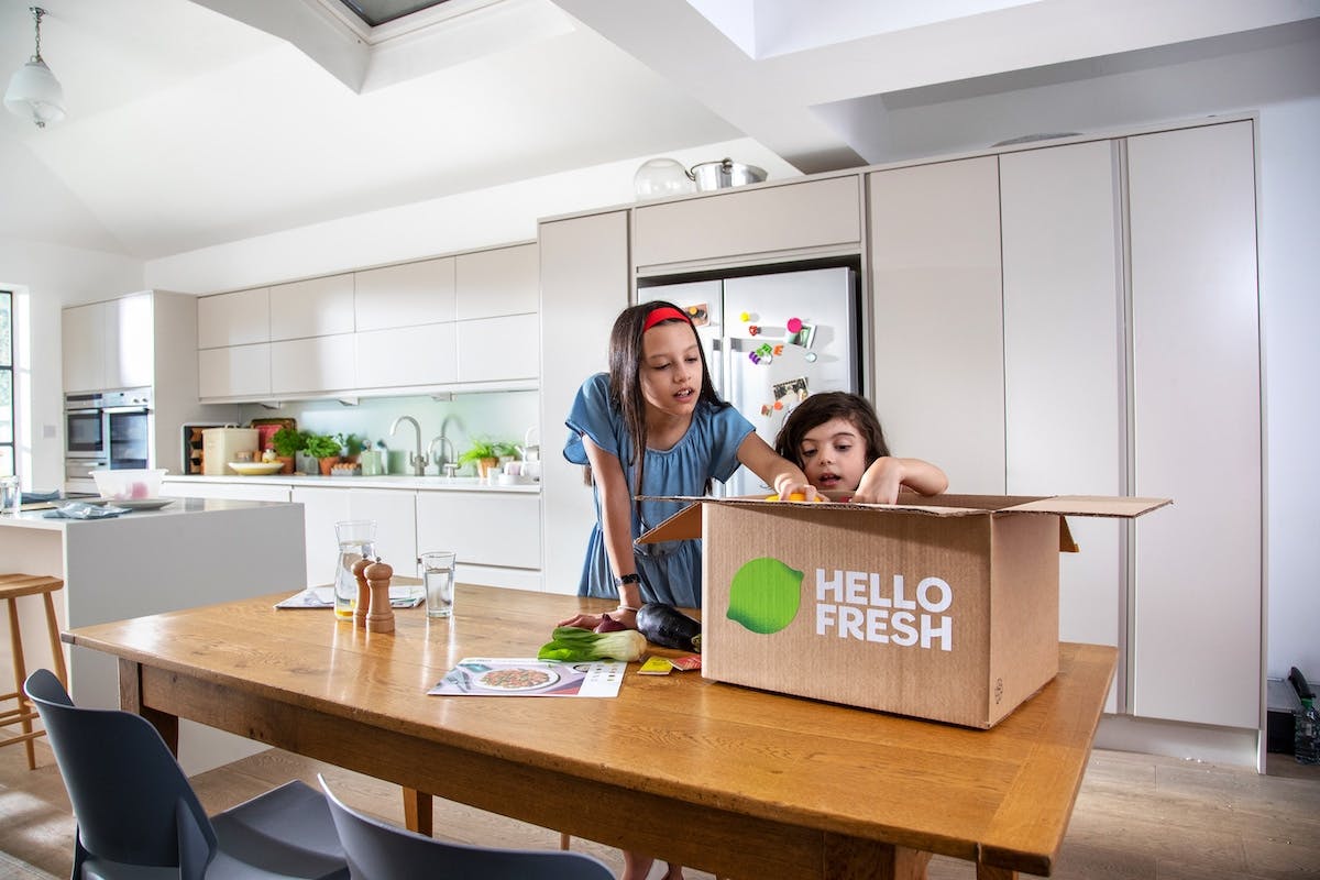 a child and child in a kitchen