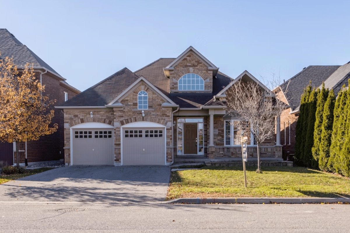 a house with a driveway and a lawn