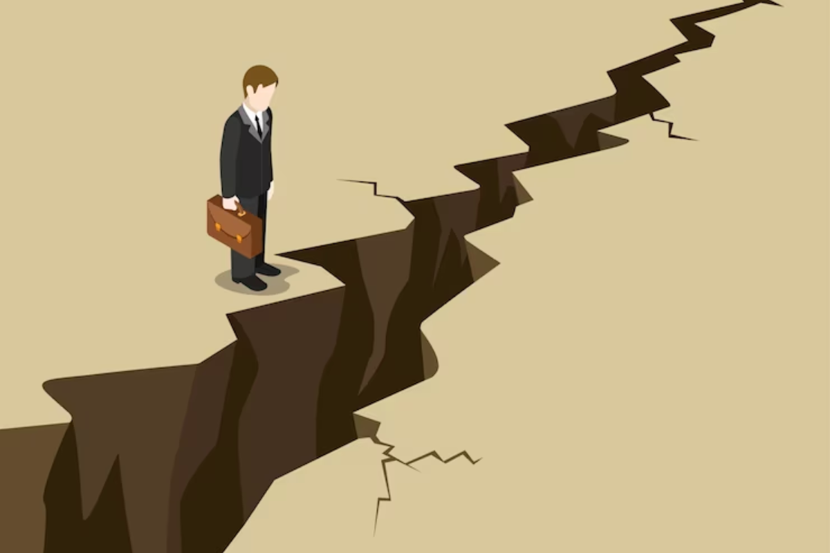 A businessman stands on a crack in the ground, symbolizing resilience and adaptability in the face of challenges.