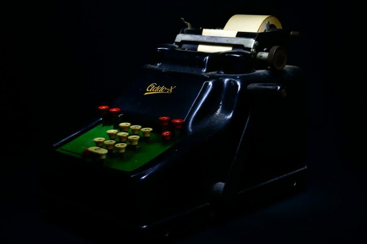 a black and blue machine with red buttons